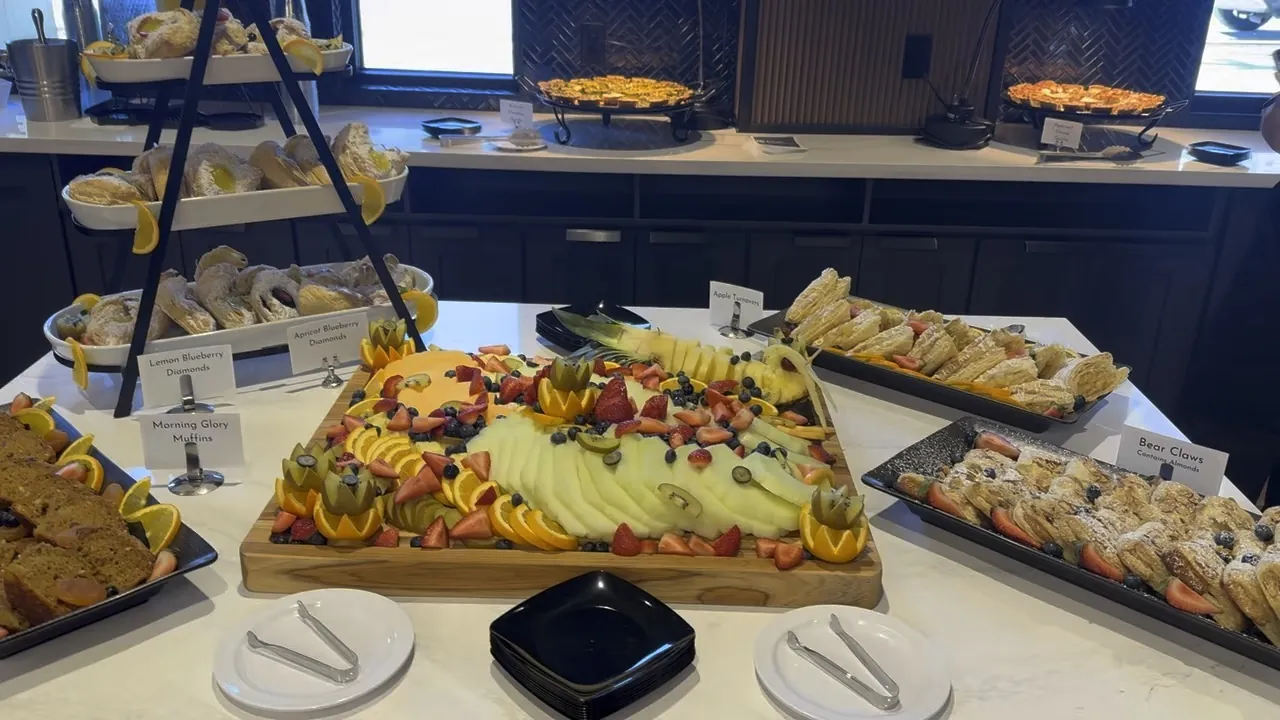 Brunch buffet with pastries, fruit and hot selections