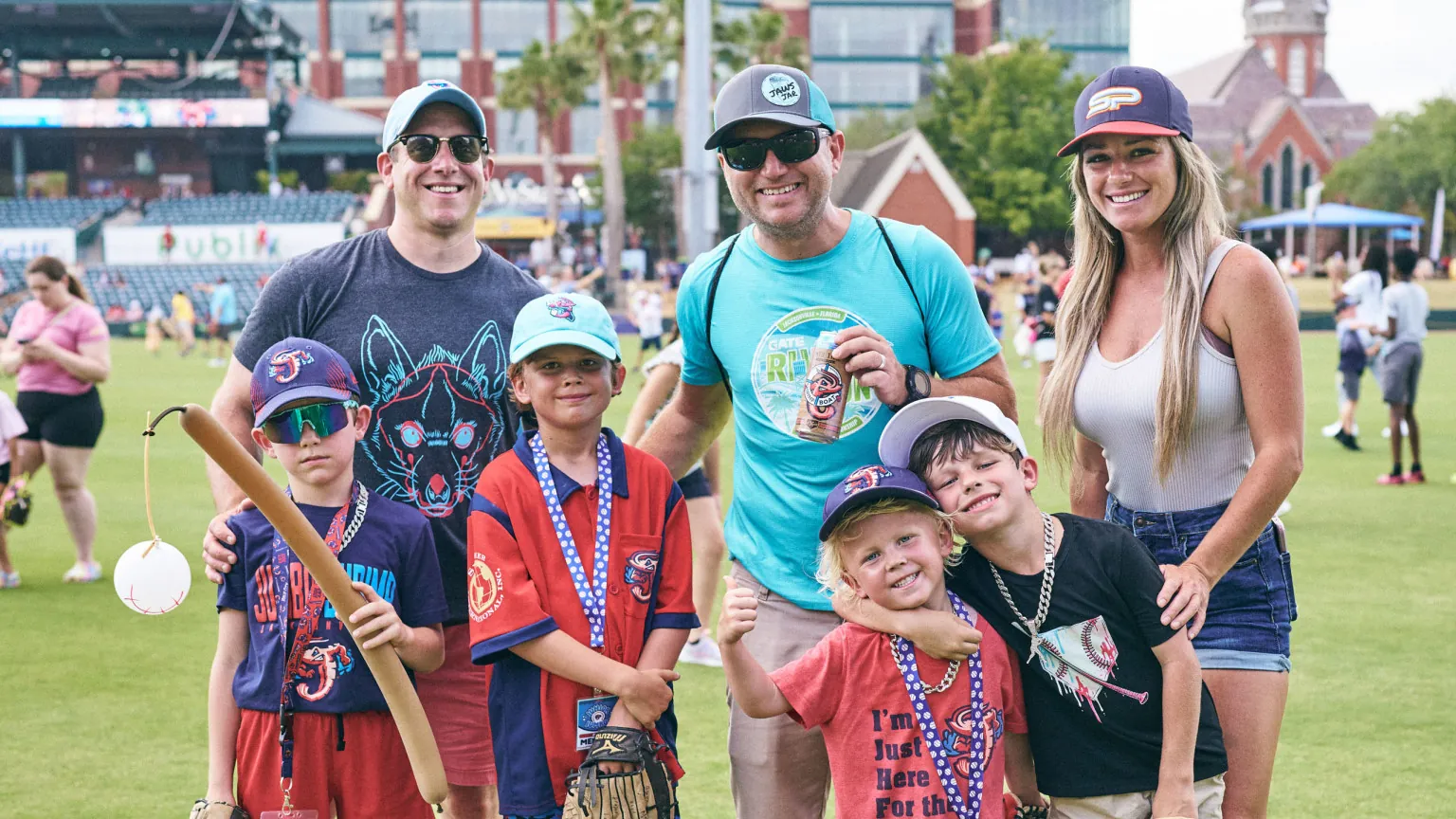 A family posing together during an on-field event
