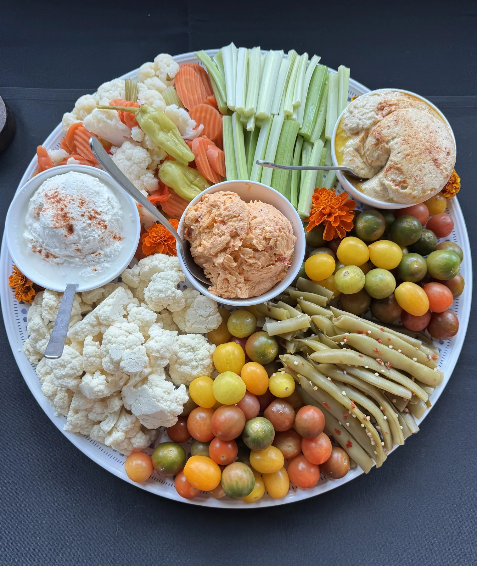 Vegetable crudité platter with hummus and creamy dips