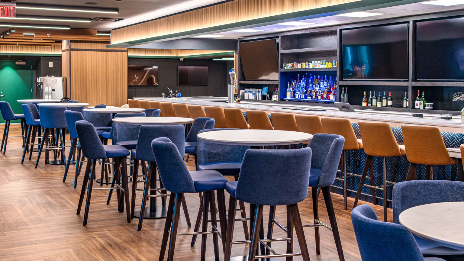Blue bar seating and lounge furniture inside PNC Home Plate Club