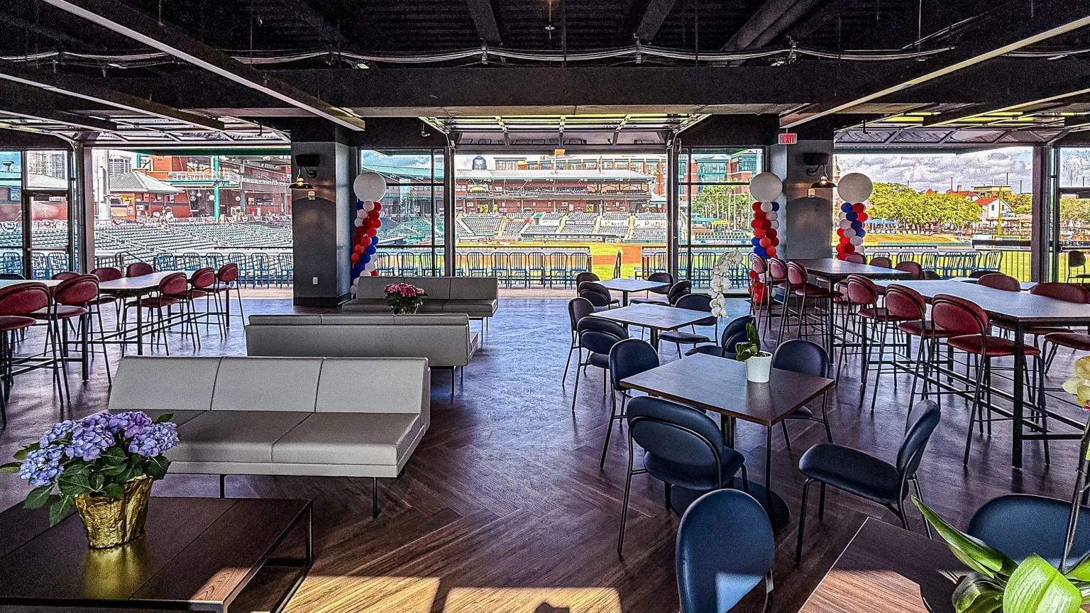 Reception seating in Harbour Hall with garage doors open to the field
